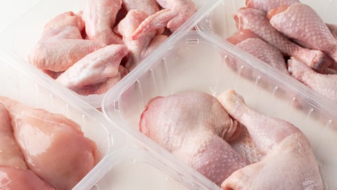 assorted types of raw chicken in packages