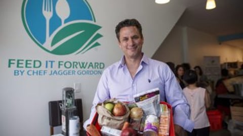 People are seen shopping for produce at Feed it Forward's Pay-what-you-can grocery store in Toronto. THE CANADIAN PRESS/Cole Burston