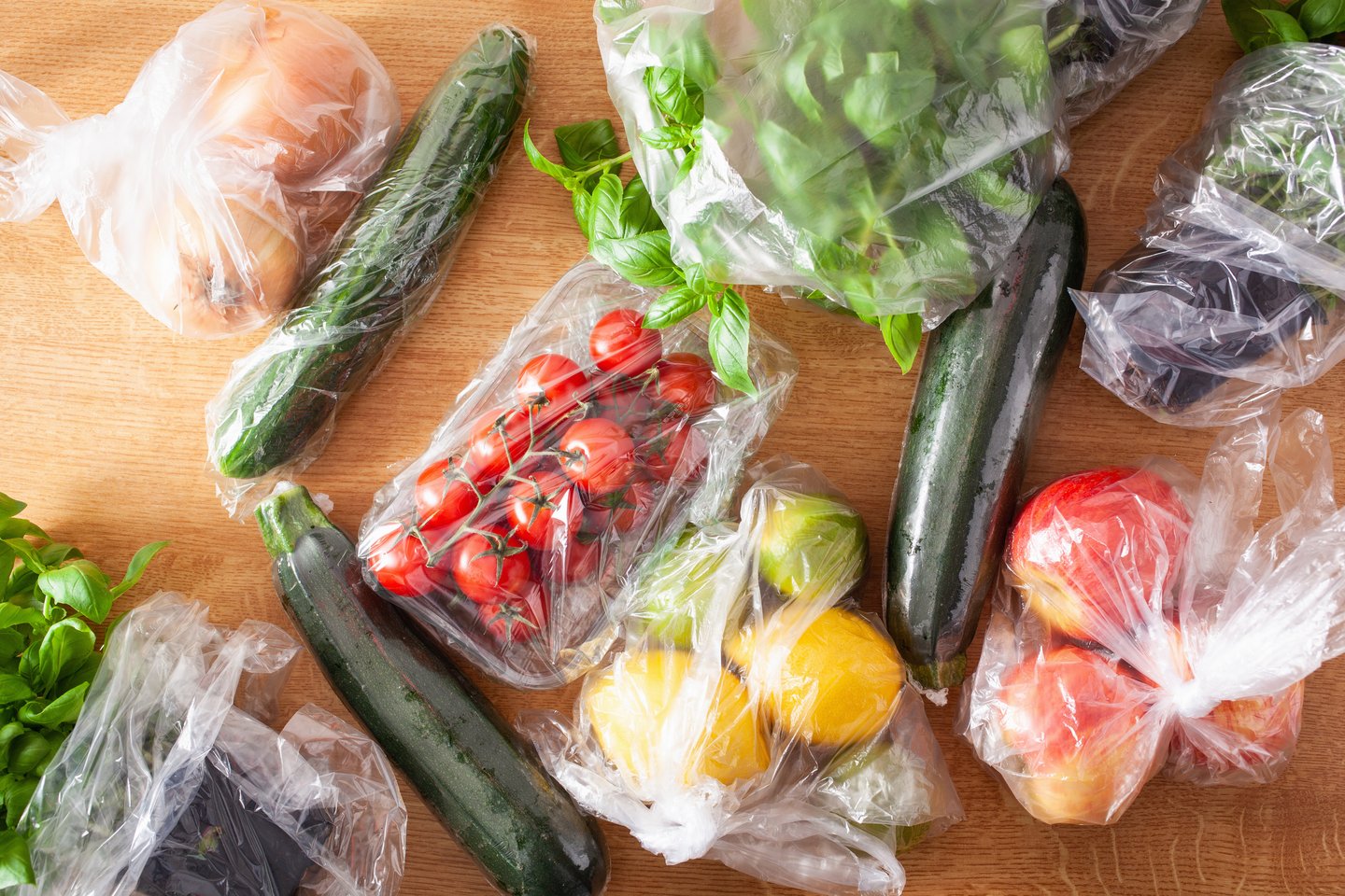 single use plastic waste issue. fruits and vegetables in plastic bags