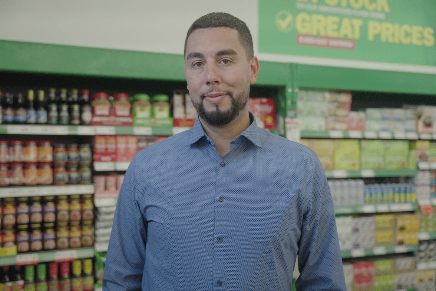 Mo Hamoud standing inside a Food Basics store