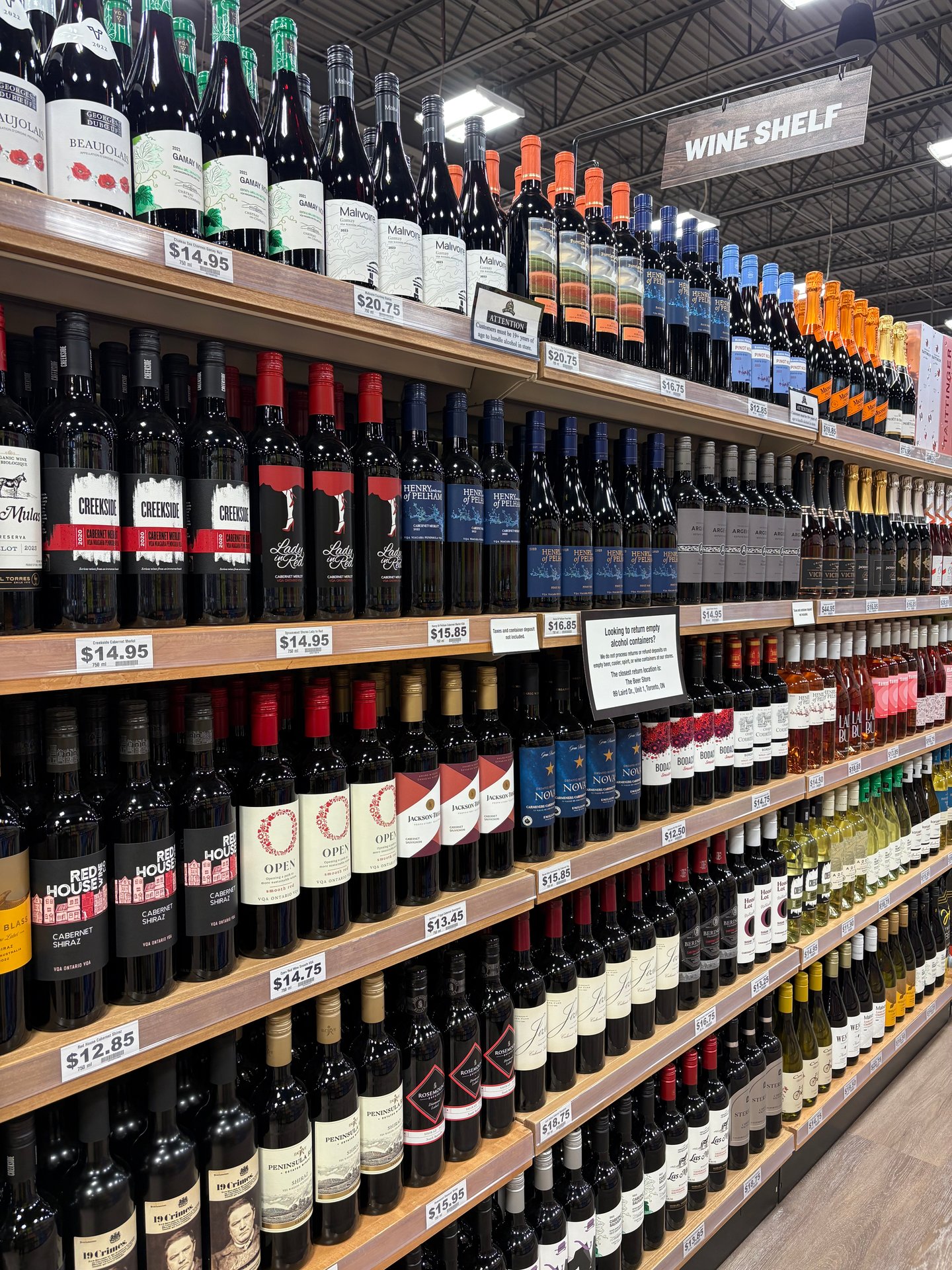 Grocery shelves stocked with wine bottles