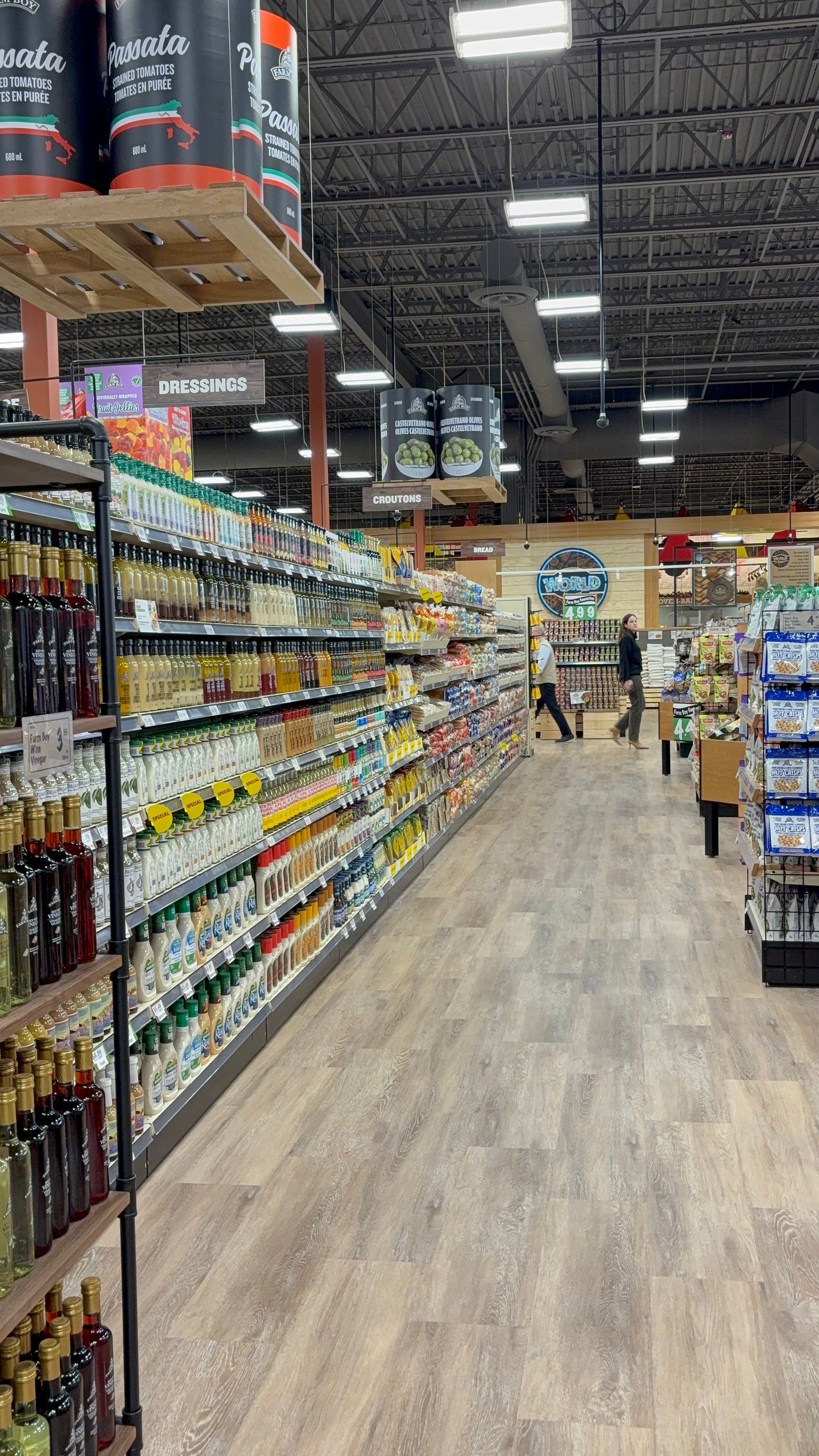 Grocery store shelves stocked with bottles of dressings