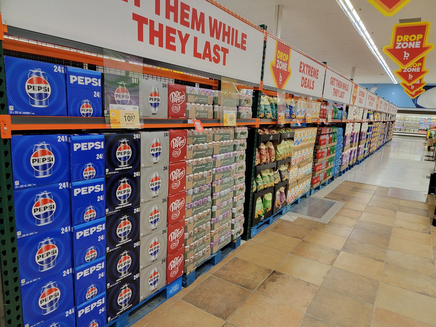 Cases of canned beverages stacked against a wall
