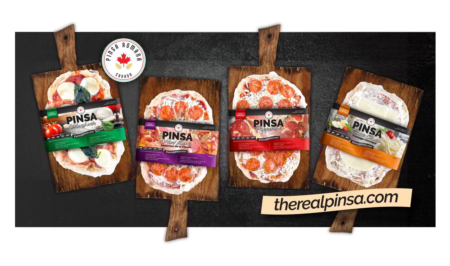 a lineup of pizzas on woods boards