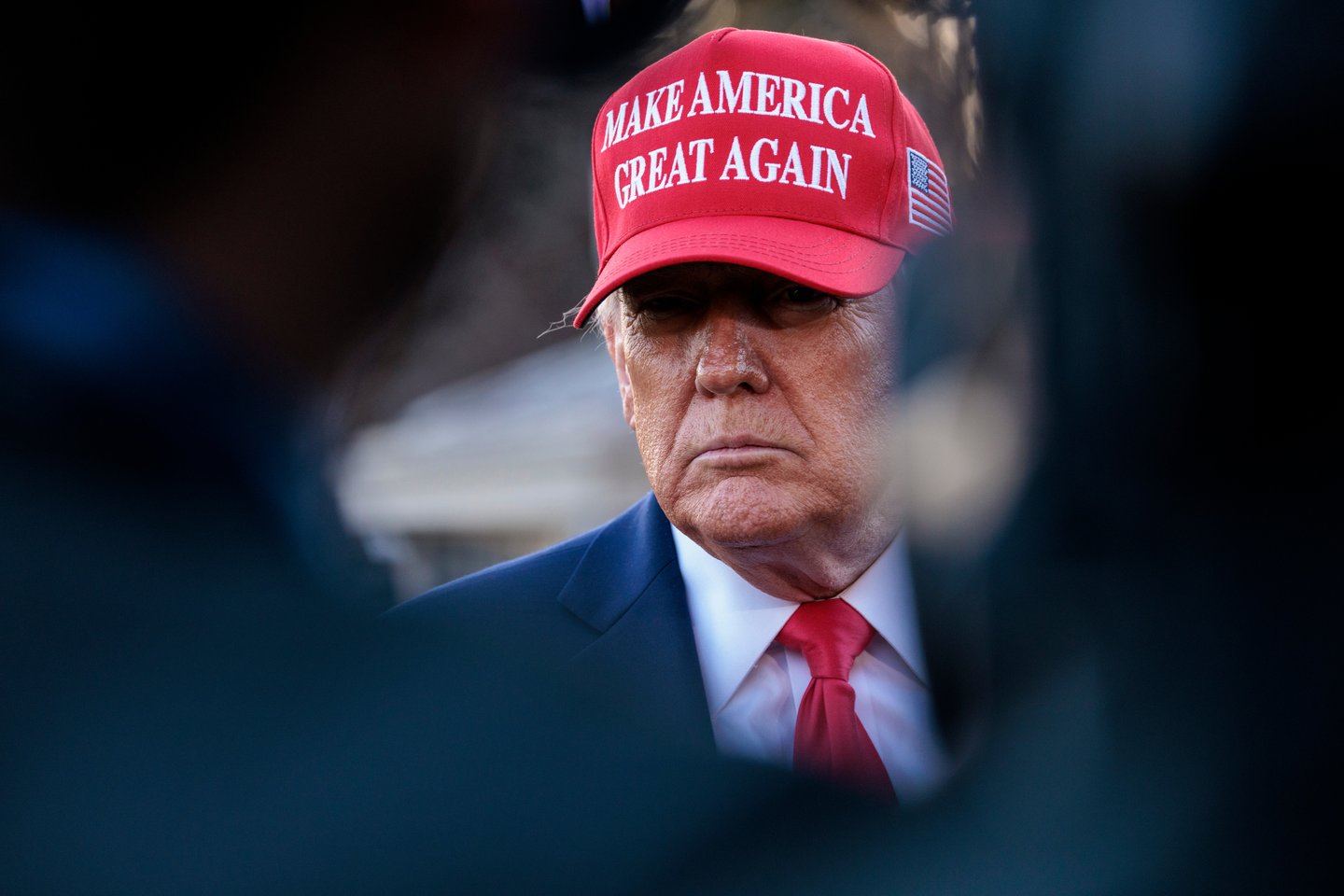 donald trump wearing a maga hat