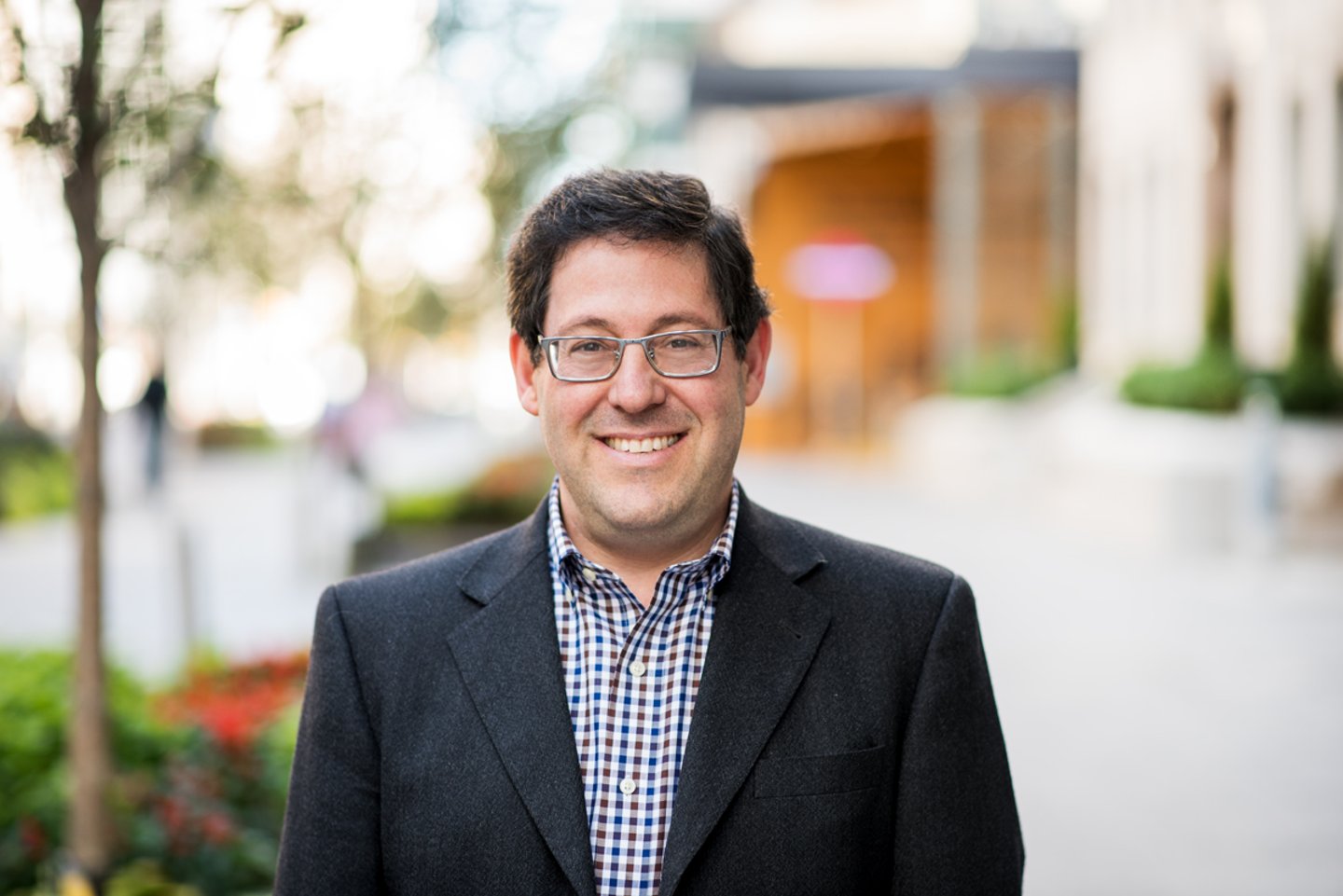 Joshua Levi standing outside wearing a blazer and dress shirt 