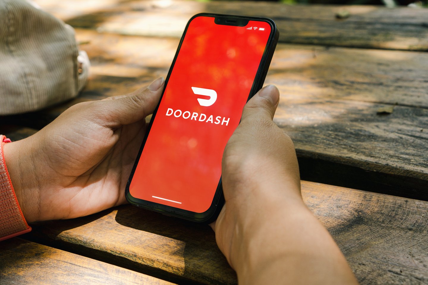 someone using doordash on their mobile phone