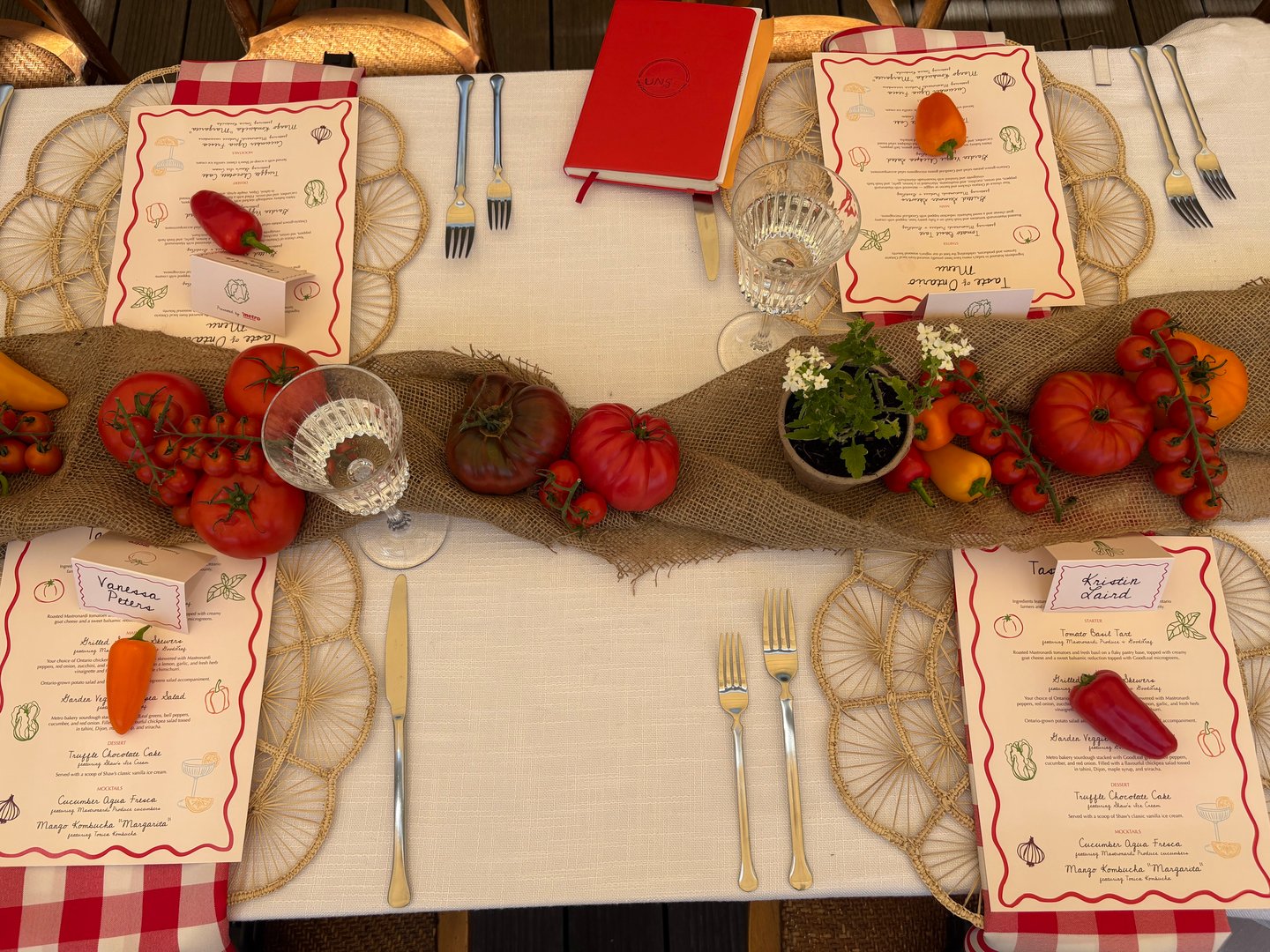A section of a long table with four place settings