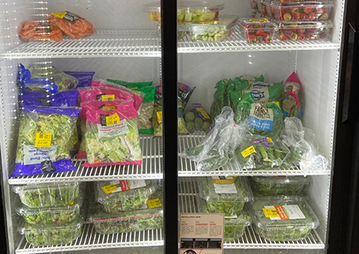 Packaged vegetables in a refrigerator