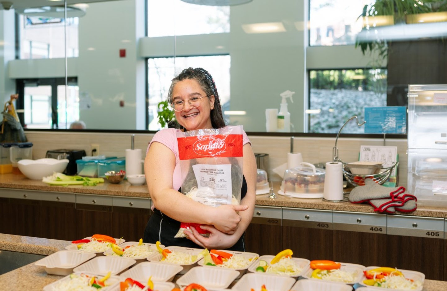 A young girl doing meal prep in a service kitchen