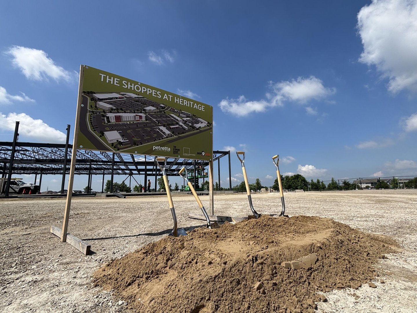 Dirt and shovels breaking ground on a mall development. Urban Reform Realty