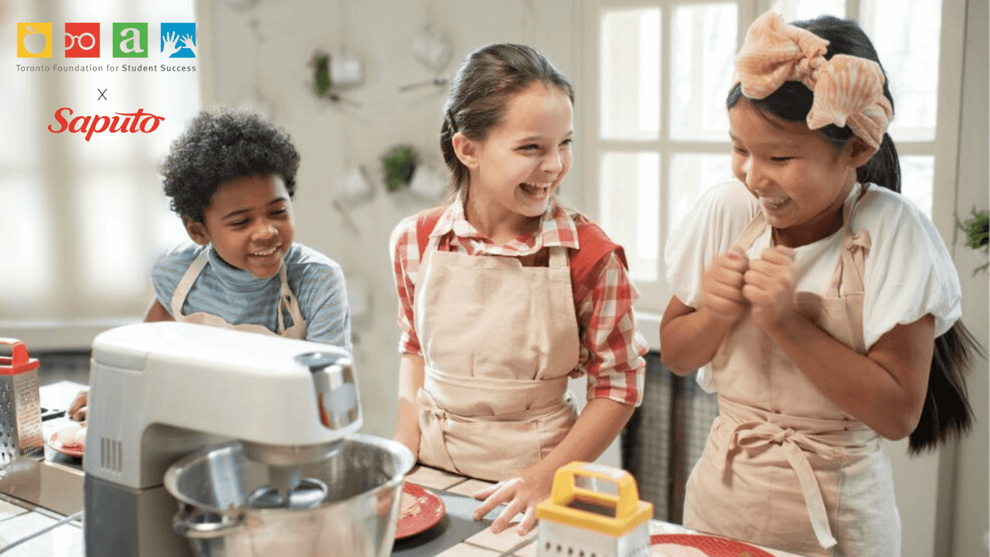 Three young kids cooking in a kitchen