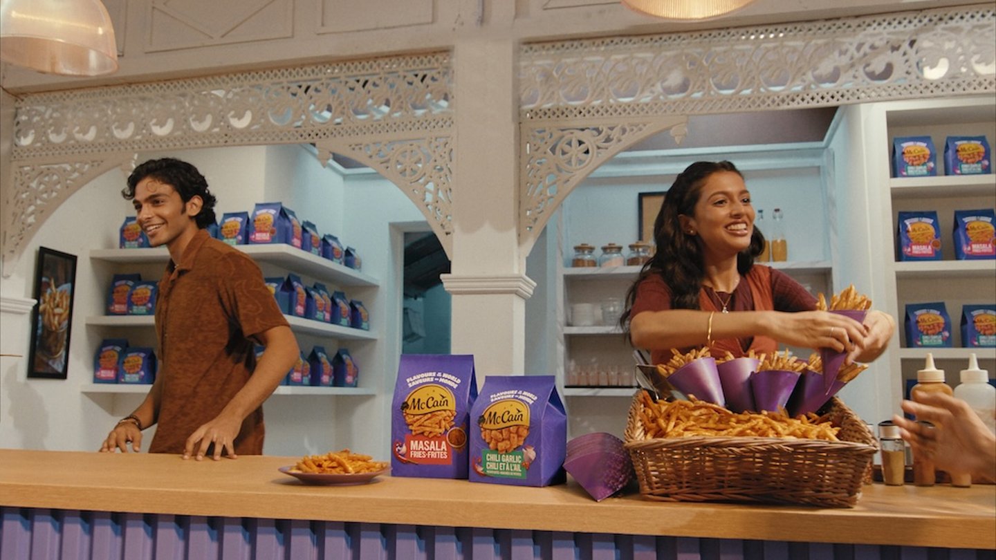 A scene from McCain's Masala Movie featuring two people selling masala fries and chili garlic potato bites