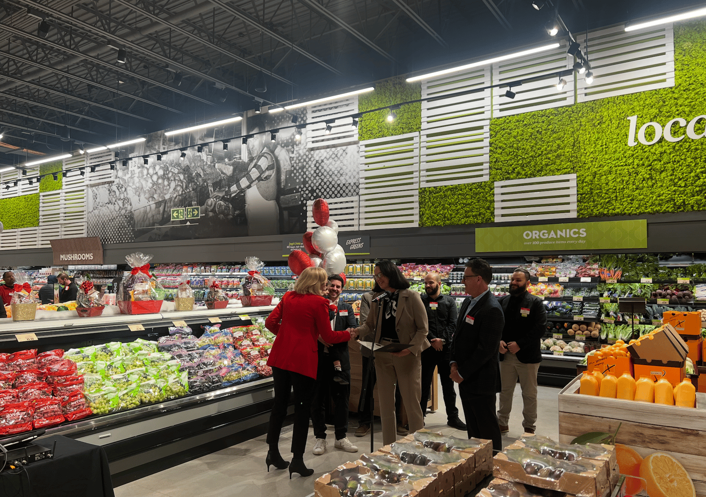 Longo's president Deb Craven shakes hands with Lee Fairclough, MPP, Etobicoke—Lakeshore
