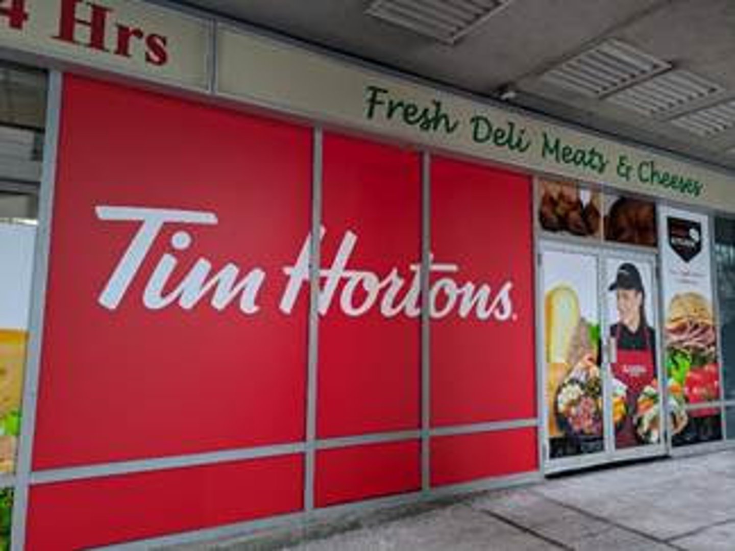 Exterior shot of a Tim Hortons signs on a Rabba store