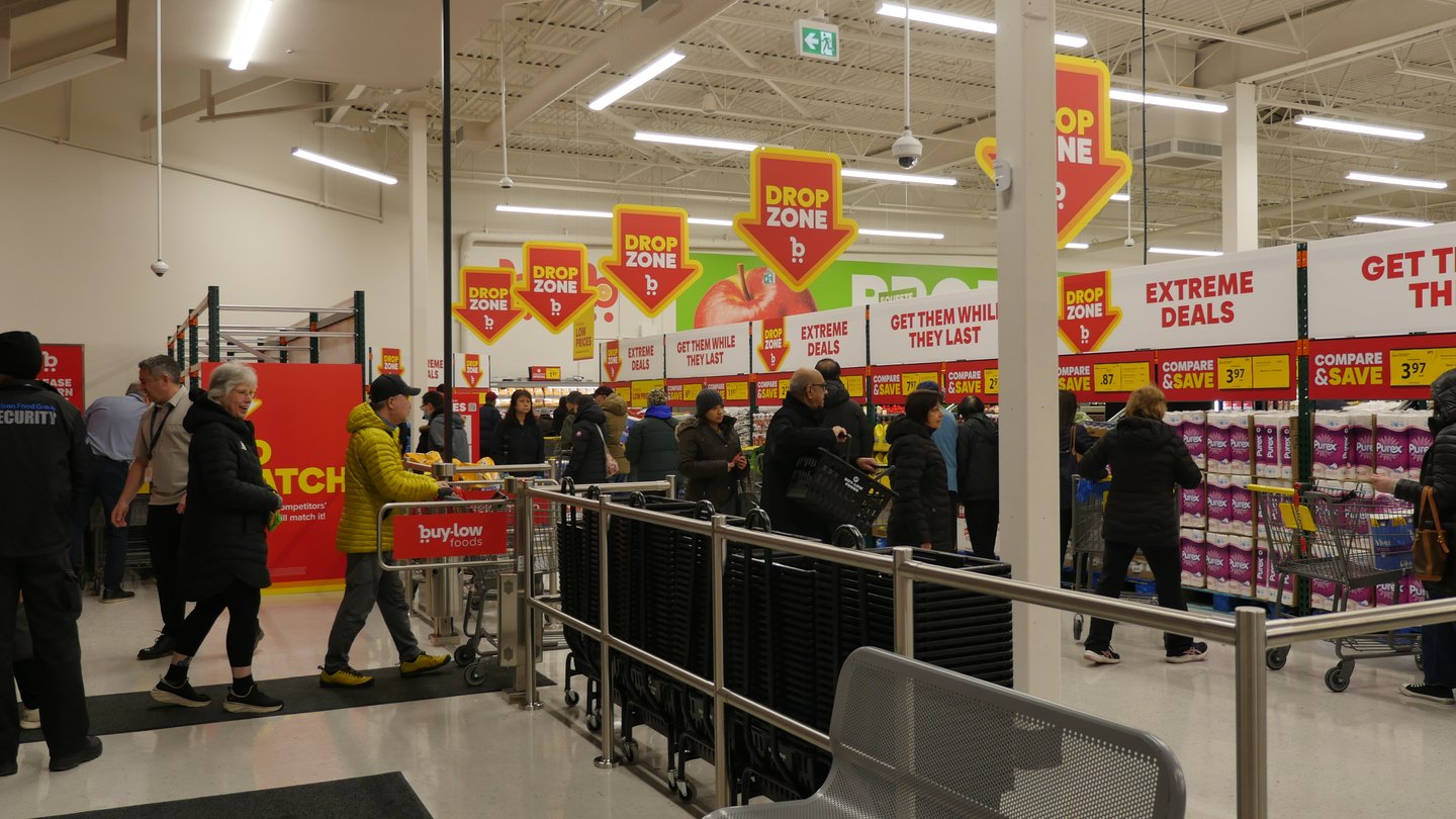 Customers enter the Buy-Low Foods Pinetree store