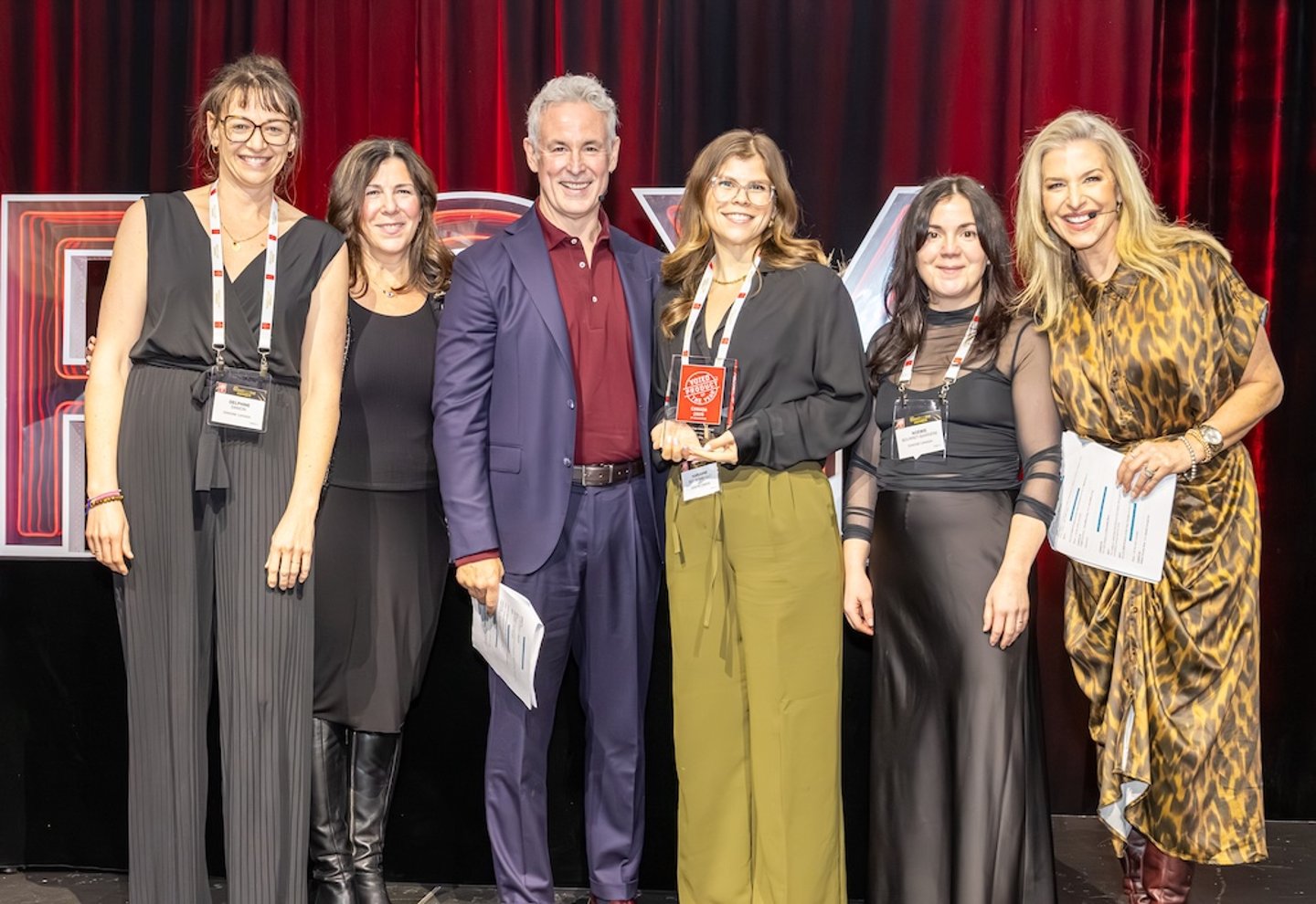 Danone Canada poses with an award 