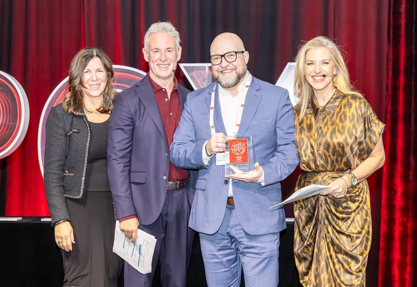 Award winner poses on stage