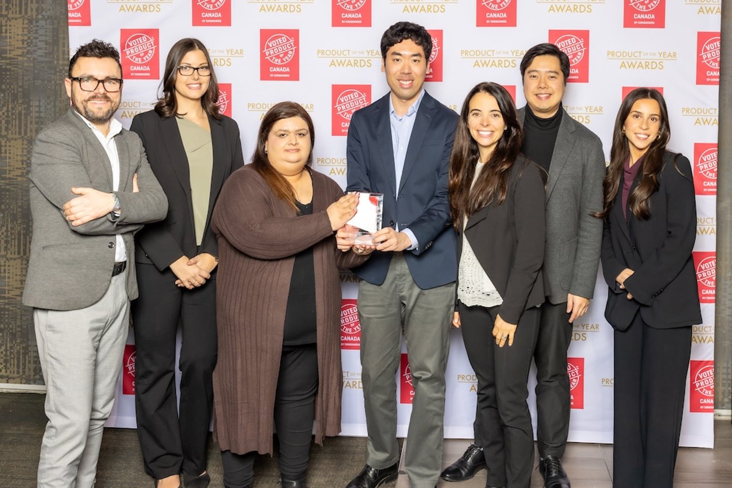 Attendees pose with their award