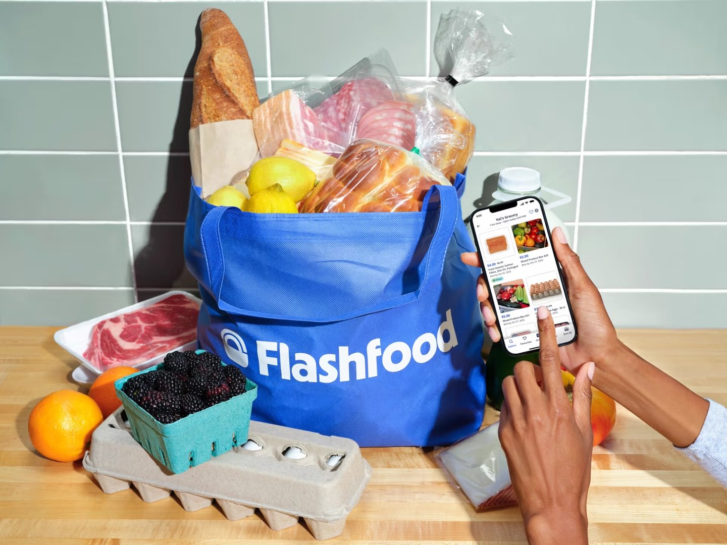 A Flashfood-branded reusable bag overflowing with groceries