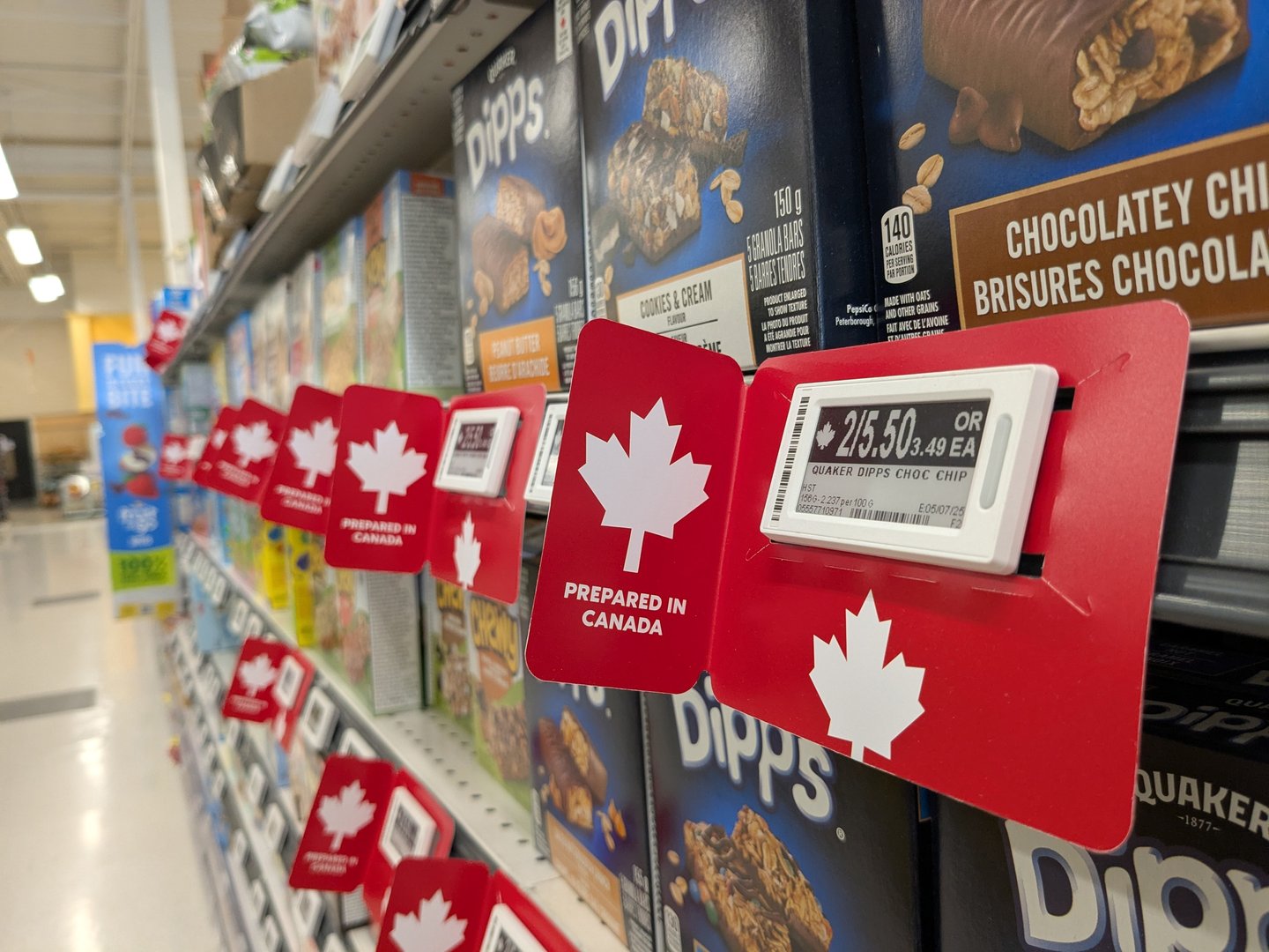 Labels on Canadian made goods at grocery store in response to the Trump administrations tariffs on Canadian goods in Ontario.