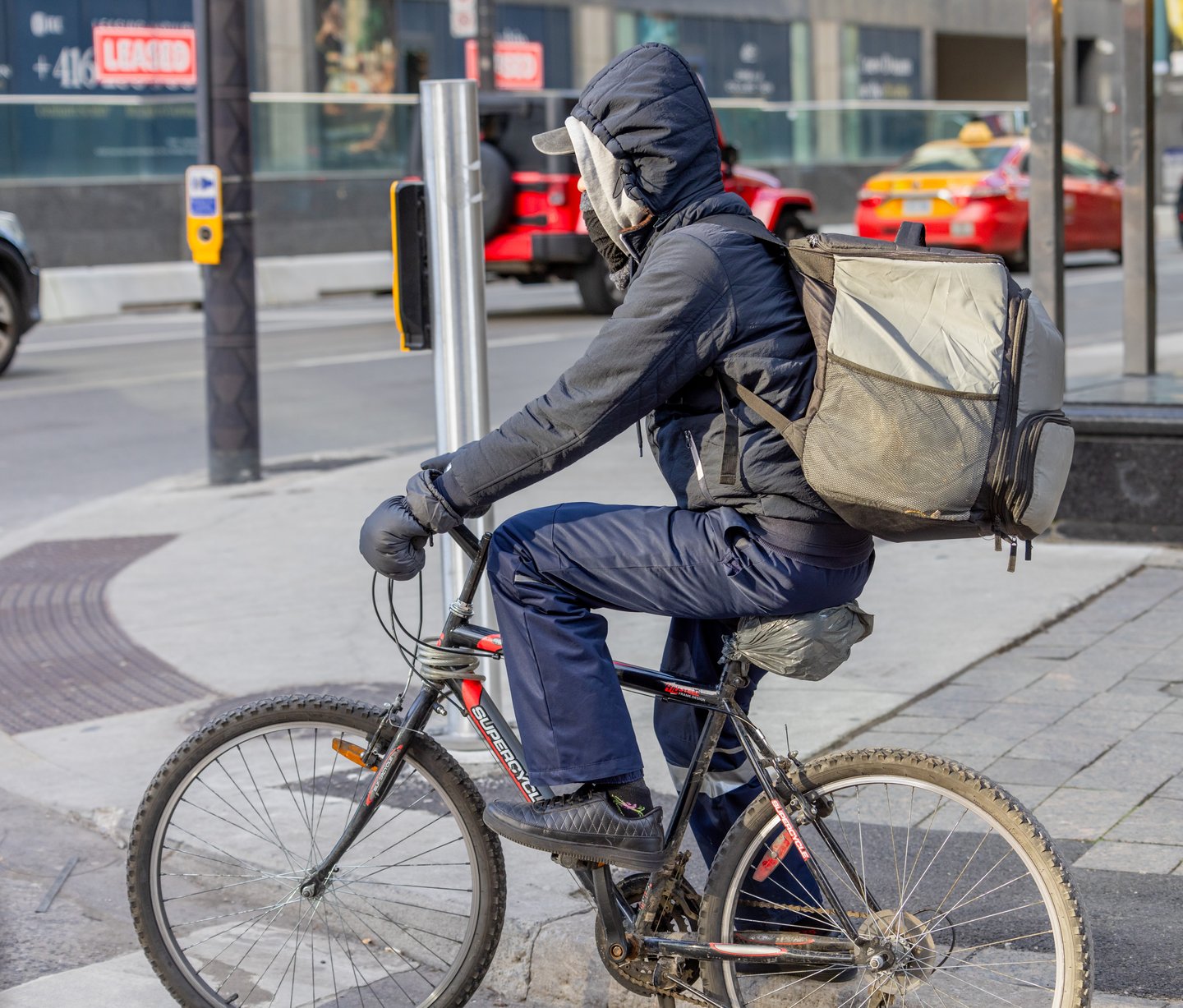  A food delivery courier on an bicycle in Toronto.