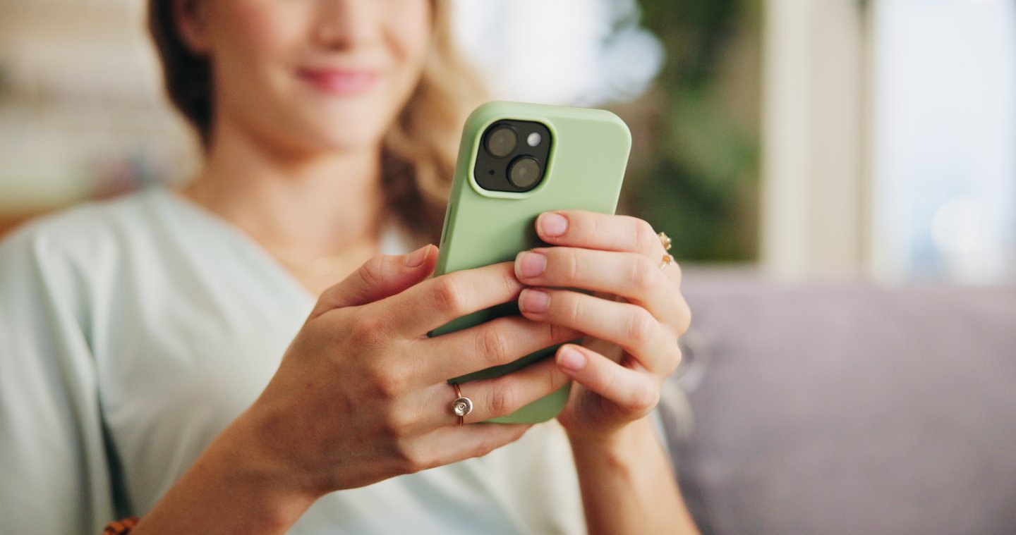 woman scrolling on phone watching videos
