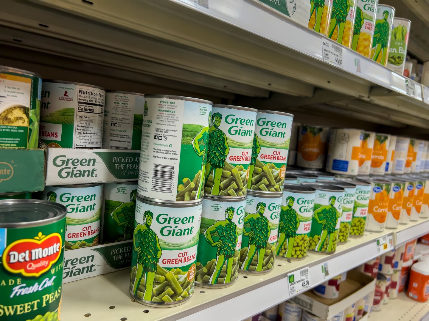 green giant and del monte brands on grocery store shelf