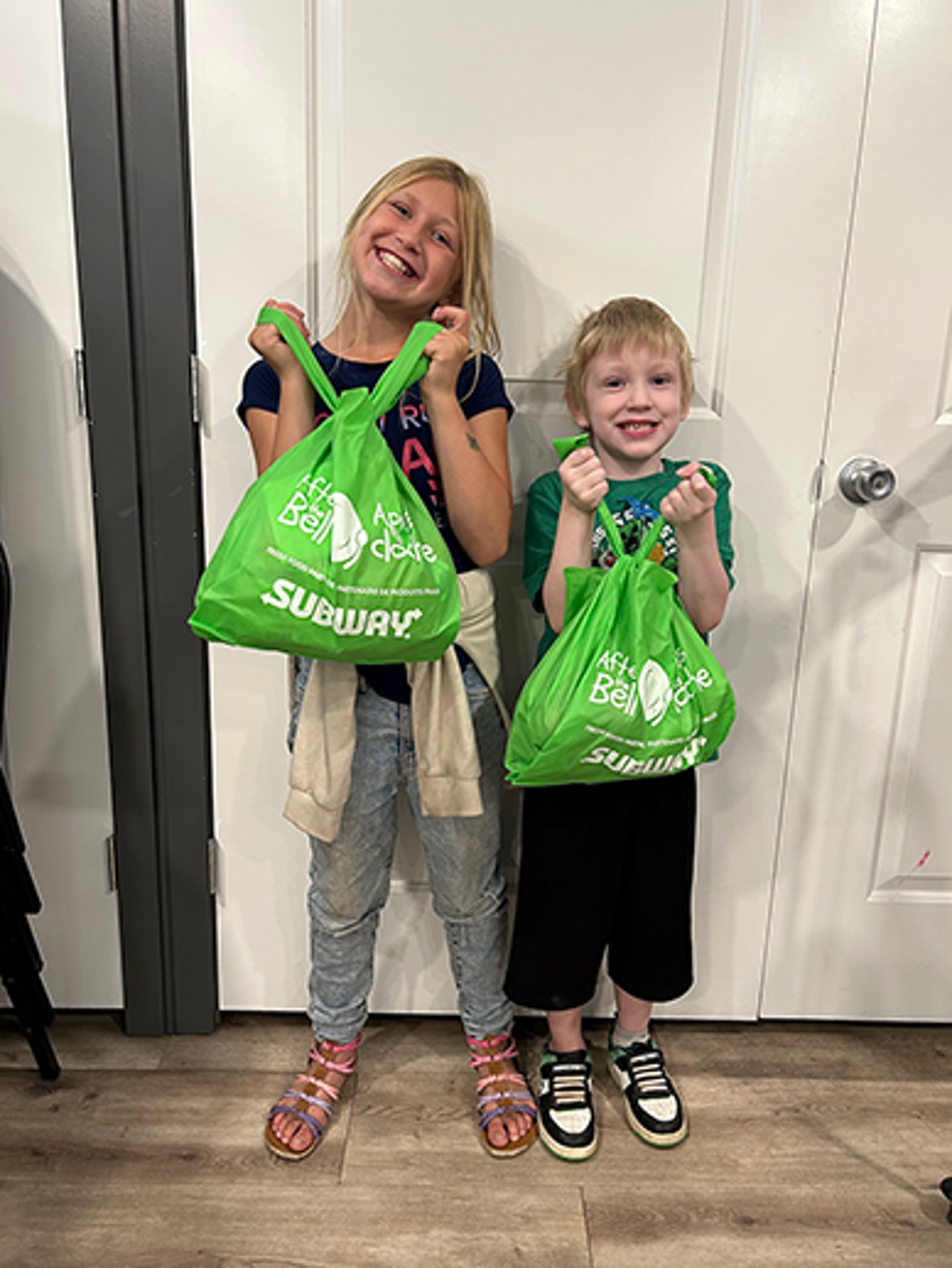 Kids holding bags from Food Banks of Canada