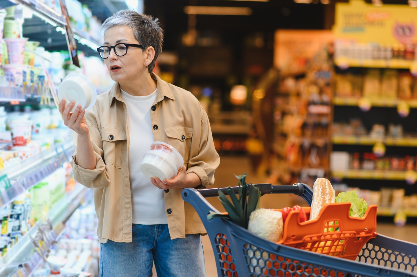 grocery shopper looking at product labels