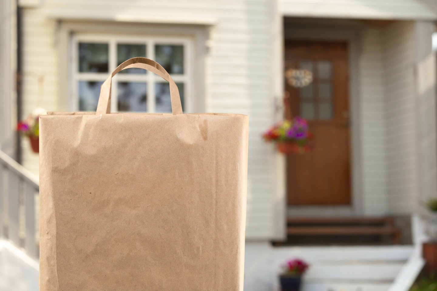 Home delivery of food grocery bag left at door; Shutterstock ID 1775429165