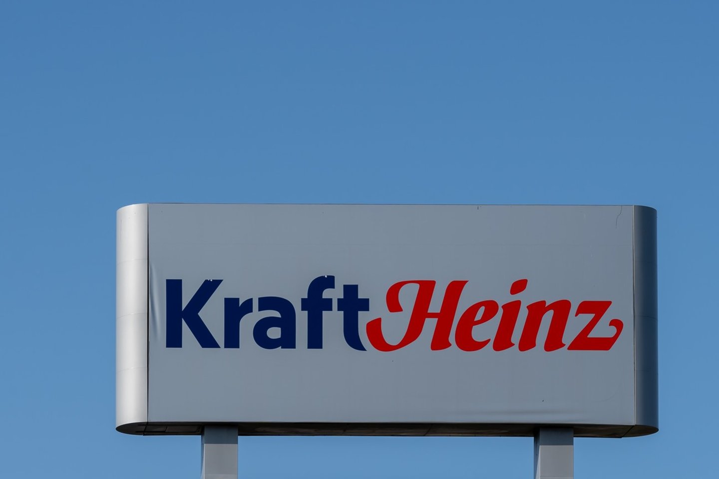 Mount-Royal, Montreal, QC, Canada - September 4, 2021: Kraft Heinz sign with blue sky in background at their plant in Montreal, QC, Canada. Kraft Heinz is an American food company. ; Shutterstock ID 2047283078