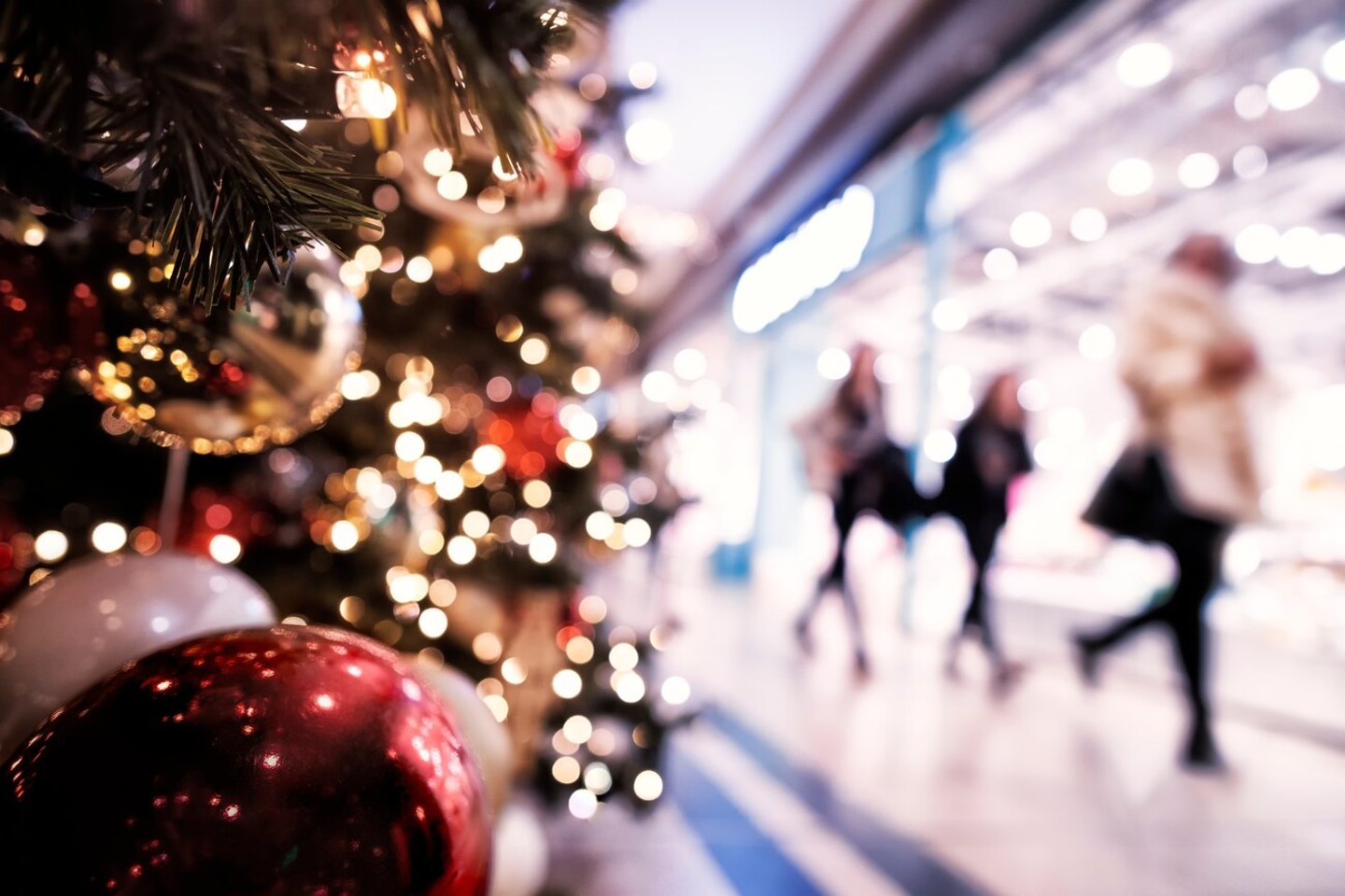 Christmas rush, Christmas lights with  silhouettes of defocused shoppers in a shopping mall; Shutterstock ID 2364614633