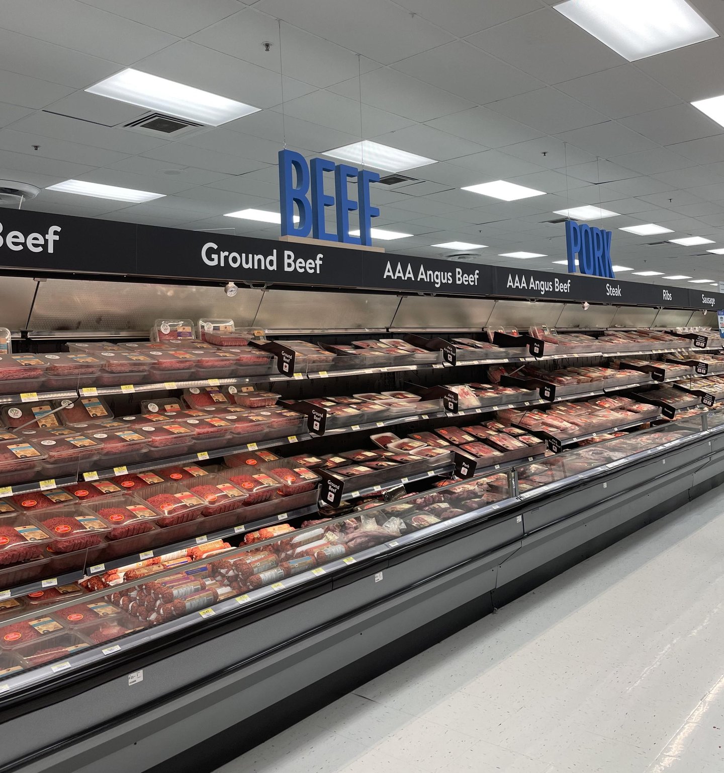 A grocery store cooler of fresh meat in the expanded Meat section of Walmart Canada's flagship store