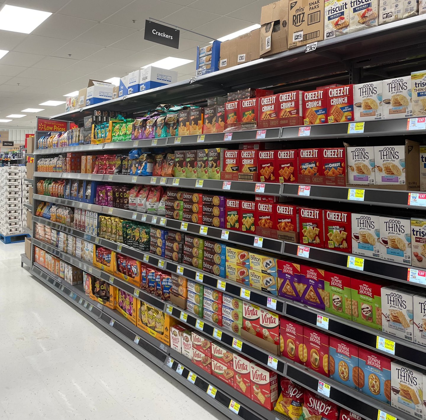 Shelves of crackers with digital shelf labels at Walmart's flagship location in Mississauga, Square One mall