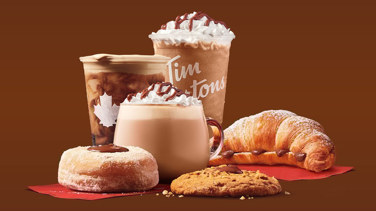 A group of classic Tim Horton menu items stacked around one another. It’s time to think outside the jar! This fall, Tim Hortons and Nutella® team up to help Canadians enjoy Nutella in a new way across six classic Tims menu items (CNW Group/Tim Hortons)