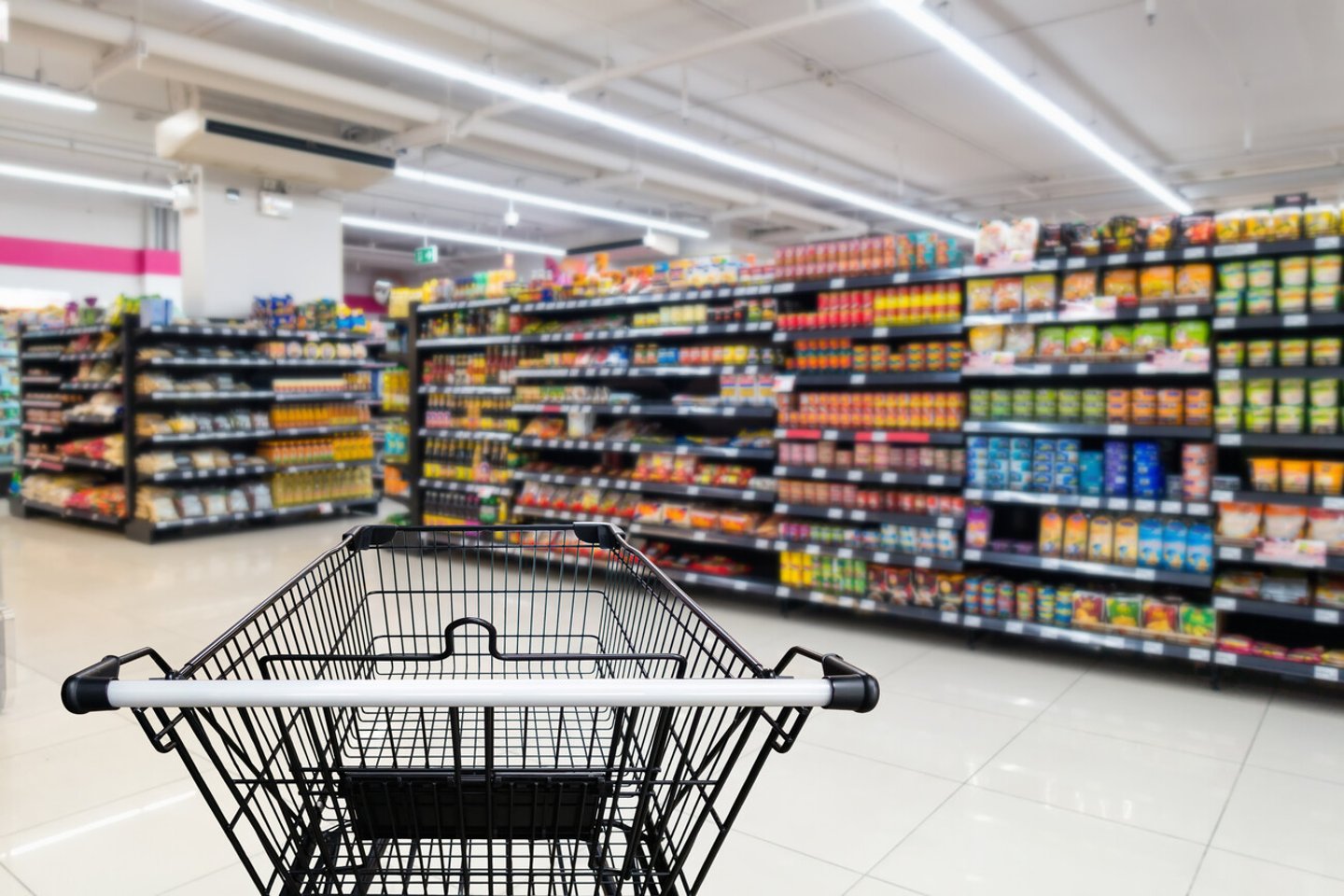 Abstract Defocused Blurred of Consumer Goods and Shopping Cart in Supermarket Store, Shop Trolley Basket in Department Store. Business Retail and Customer Shopping Mall Service, Motion Blurry Concept.; Shutterstock ID 1099622996