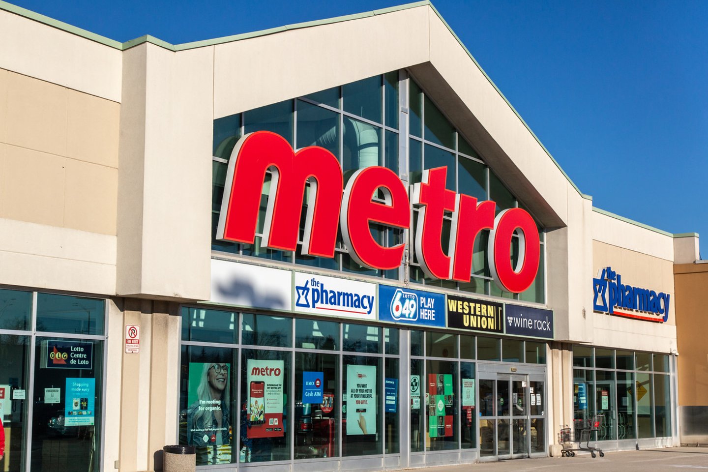 Mississauga, Canada, March 2, 2021;  The iconic sign and roof line on Quebec based Canadian business Metro grocery store in Missisauga; Shutterstock ID 1928049206