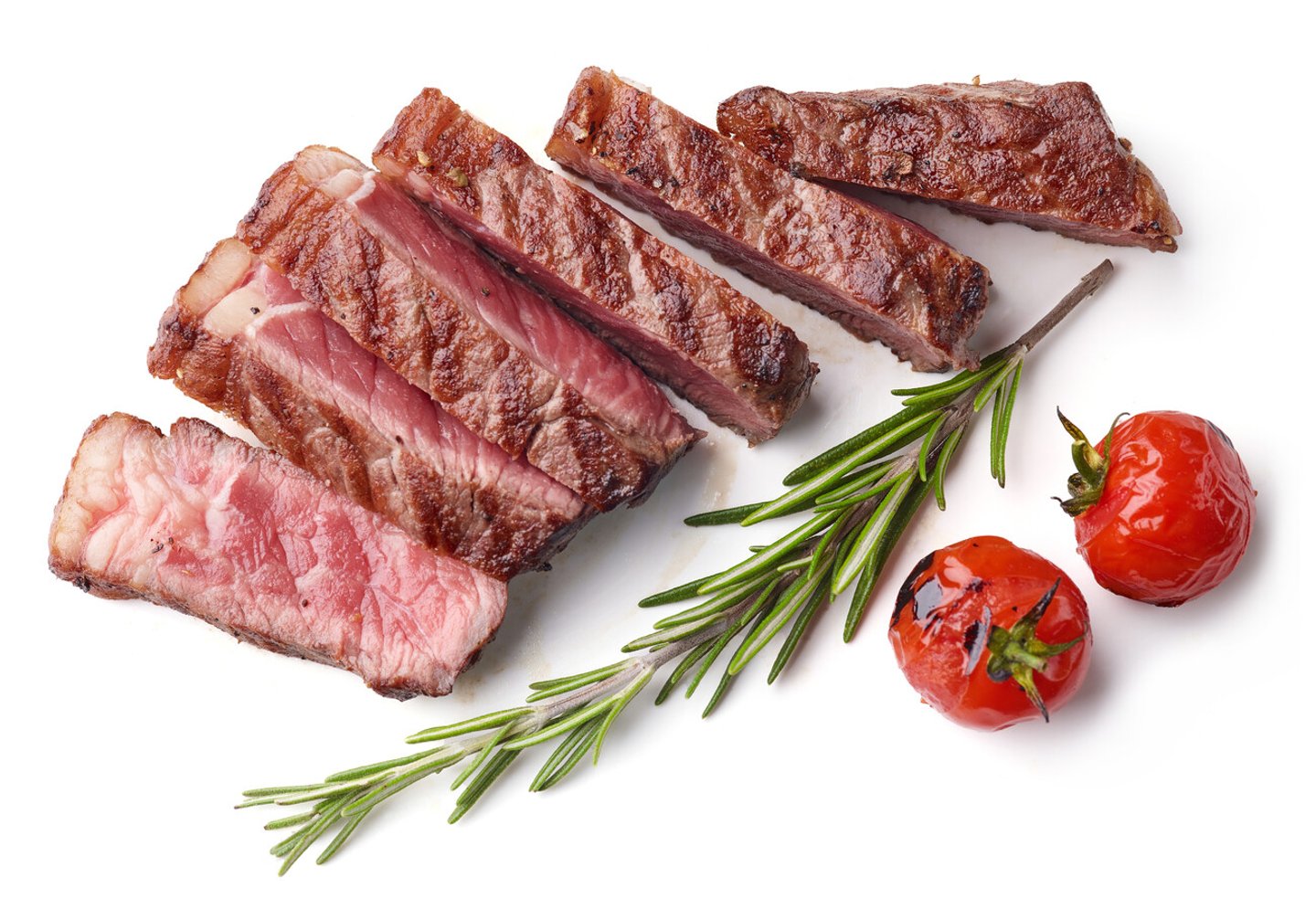 Grilled Sliced Beef Steak with tomatoes and rosemary Isolated on white background top view; Shutterstock ID 1572051148