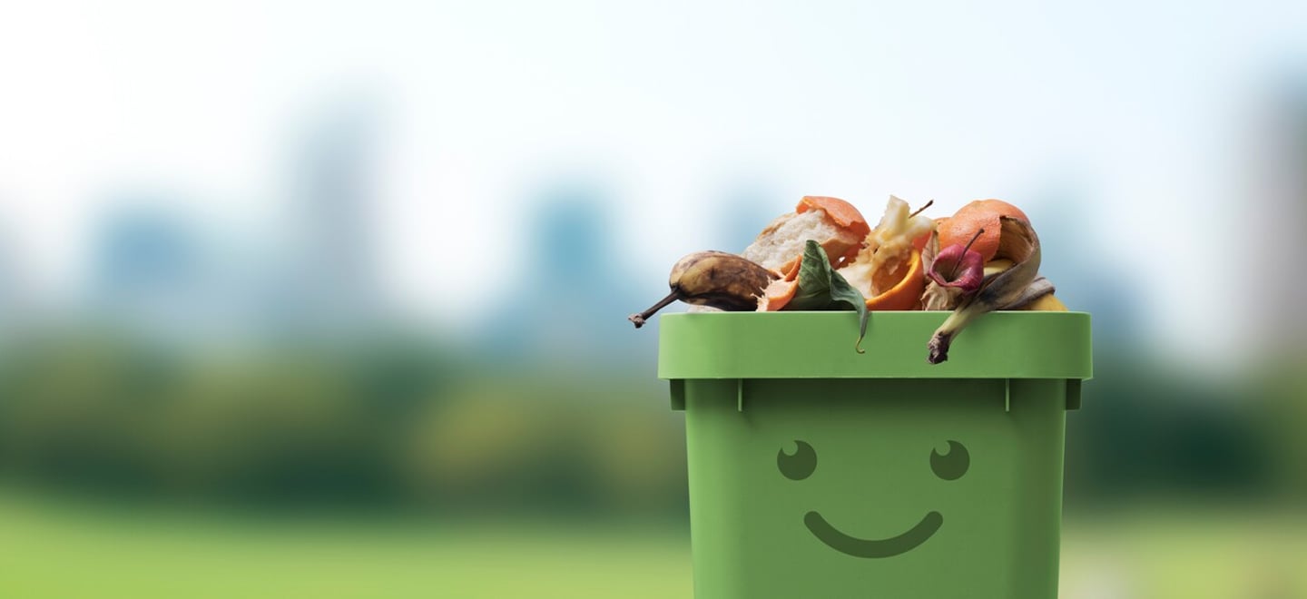 Smiling cute garbage bin character full of organic biodegradable waste, separate waste collection and recycling concept; Shutterstock ID 2135886895