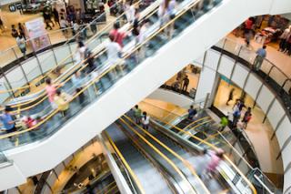 Mall escalator crowded with shoppers