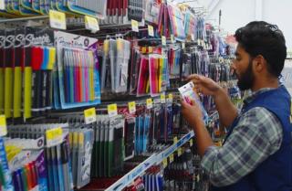 walmart canada employee stocking shelves