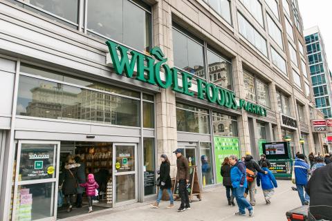People are coming in a Whole Foods grocery store on Union Square in Manhattan.