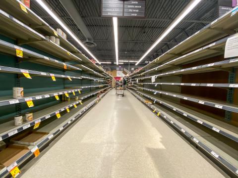 Shutterstock/Steeve Raye NORTH VANCOUVER, BC, CANADA - MAR 15, 2020: Shelf at a supermarket mostly empty with only a few packages of toilet paper left amid panic buying as the coronavirus spreads.