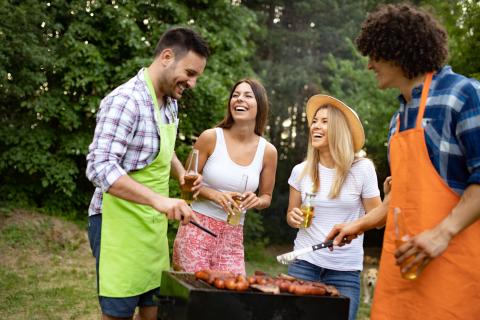 Group of happy young friends having barbecue party, outdoors