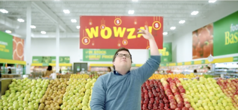 A man standing in the produce section of a Food Basics store shopping the Wowza sale