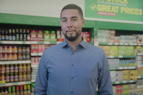 Mo Hamoud standing inside a Food Basics store