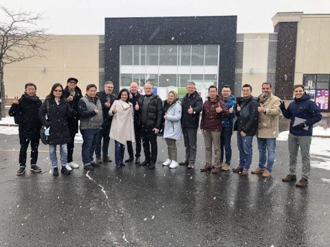 T&T team and Carbonleo team group photo at the Brossard store front