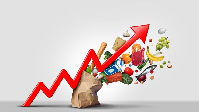 Rising food cost and grocery prices surging costs of supermarket groceries as an inflation financial crisis concept hit by as a finance graph arrow with 3D render elements.
