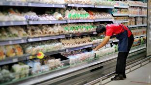 Portrait of a man is worker or staff dairy stocking or checking food products at supermarket or store